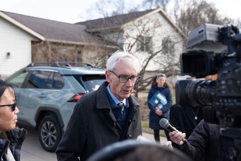 Gov. Tony Evers answers questions from the press after visiting residents on French Island, who found out their water was contaminated with PFAS in 2021, on the afternoon of April 6, 2026 in Campbell, Wisconsin. Gov. Evers signed two bills into law that address PFAS earlier that day.