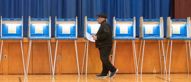 Michael Simmons, 65, carries his ballot after voting at Ninety-Fifth Street School at 3707 N. 94th St. in Milwaukee, Wisconsin on Tuesday, April 7, 2026 for spring elections.