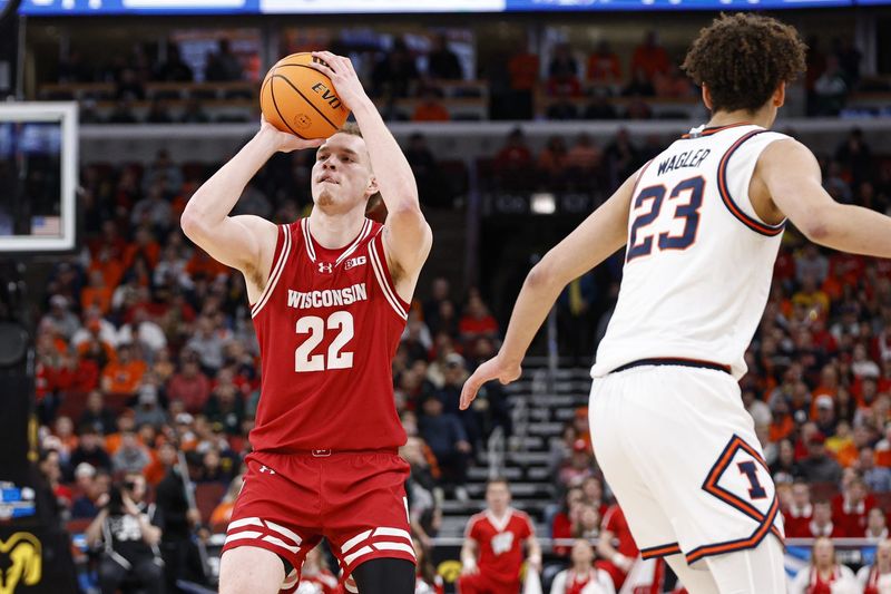 Mar 13, 2026; Chicago, IL, USA; Wisconsin Badgers forward Austin Rapp (22) shoots against Illinois Fighting Illini guard Keaton Wagler (23) during the first half at United Center. Mandatory Credit: Kamil Krzaczynski-Imagn Images