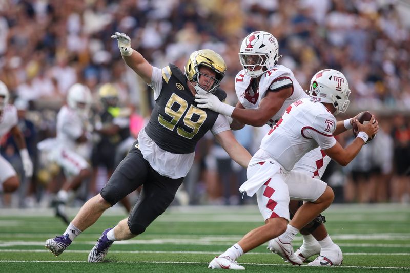 Sep 20, 2025; Atlanta, Georgia, USA; Georgia Tech Yellow Jackets defensive lineman Jordan van den Berg (99) rushes the passer against the Temple Owls in the second quarter at Bobby Dodd Stadium at Hyundai Field. Mandatory Credit: Brett Davis-Imagn Images
