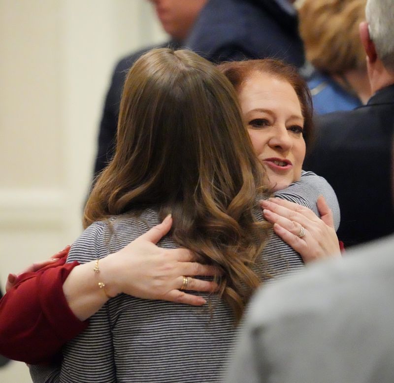 Wisconsin Supreme Court candidate Maria Lazar, right, thanks supporters after conceding to Chris Taylor during Lazar's election night watch party on Tuesday, April 7, 2026, at the Ingleside Hotel in Pewaukee, Wisconsin.