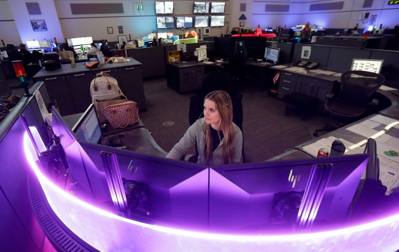 Alexis Weishaar works at the Brown County dispatch center on April 2, 2026, in Green Bay, Wis.