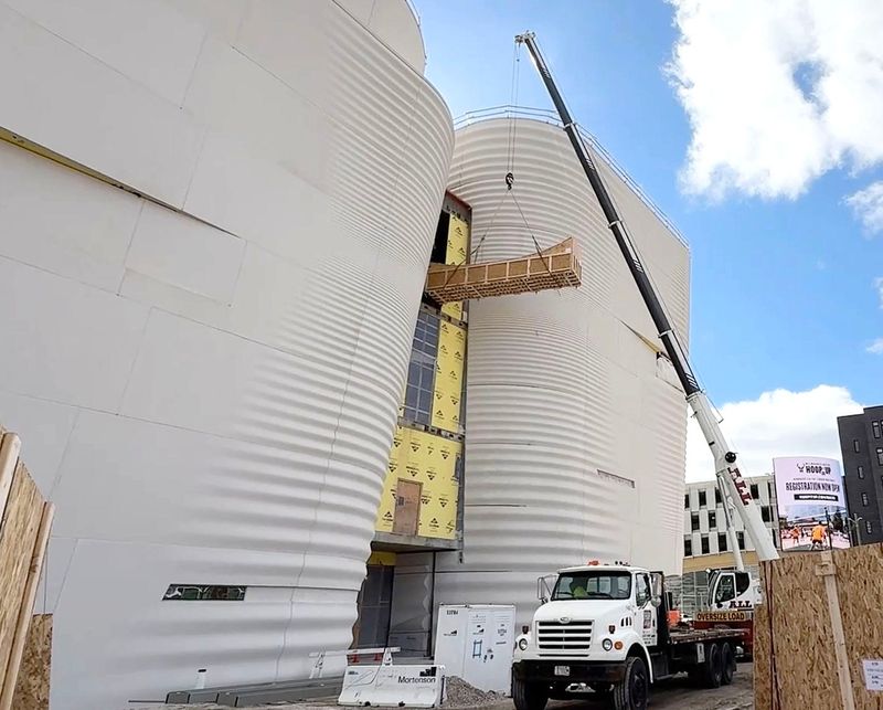 Milwaukee Public Museum's replica Haida canoe is the first exhibit component moved into the new Nature & Culture Museum of Wisconsin under construction. The boat's size required that it be moved with a crane before windows were installed in the new museum.