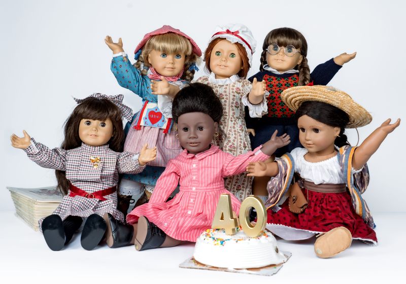 The six original American Girl dolls – clockwise from top left: Kirsten Larson, Felicity Merriman, Molly McIntire, Josefina Montoya, Addy Walker and Samantha Parkington – celebrate their 40th anniversary (really, the 40th anniversary of Pleasant Company, which first made them) in the Milwaukee Journal Sentinel offices on Wednesday, April 8, 2026, in Milwaukee, Wisconsin.