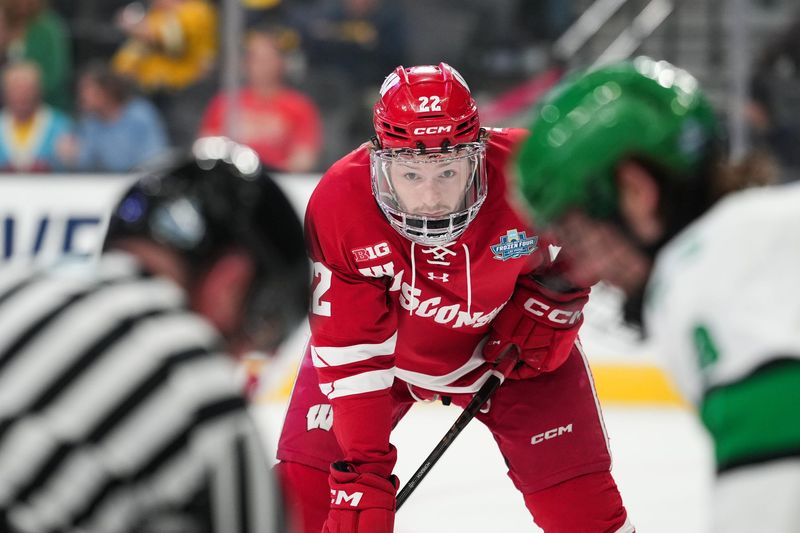 Apr 9, 2026; Las Vegas, Nevada, UNITED STATES; Wisconsin Badgers forward Jack Horbach (22) prepares for a face off against the North Dakota Fighting Hawks in the semifinals of the NCAA men's ice hockey Frozen Four at T-Mobile Arena. Mandatory Credit: Lucas Peltier-Imagn Images