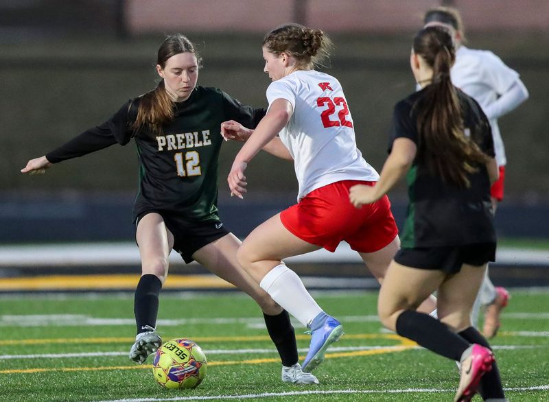 Green Bay Preble High School's Sophia Smith (12) defends Kimberly High School's Ashlyn Krueger (22) on Friday, April 10, 2026, at Green Bay Preble High School in Green Bay, Wis. Kimberly won the match, 4-0.
Tork Mason/USA TODAY NETWORK-Wisconsin