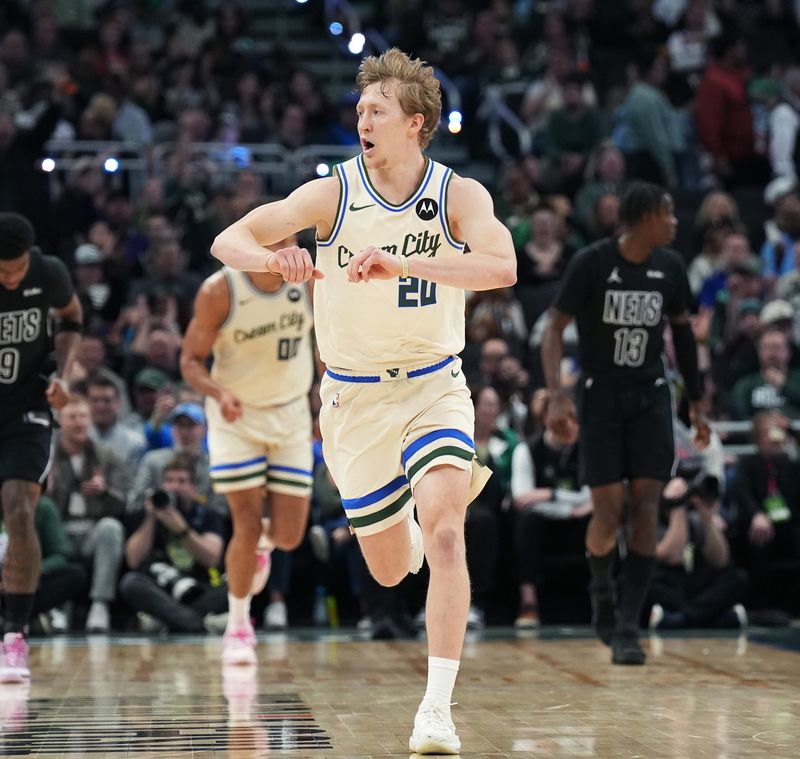 Milwaukee Bucks guard AJ Green (20) celebrates scoring three point basket during the first half of the game against the Brooklyn Nets on Friday April 10, 2026 at Fiserv Forum in Milwaukee, Wisconsin.