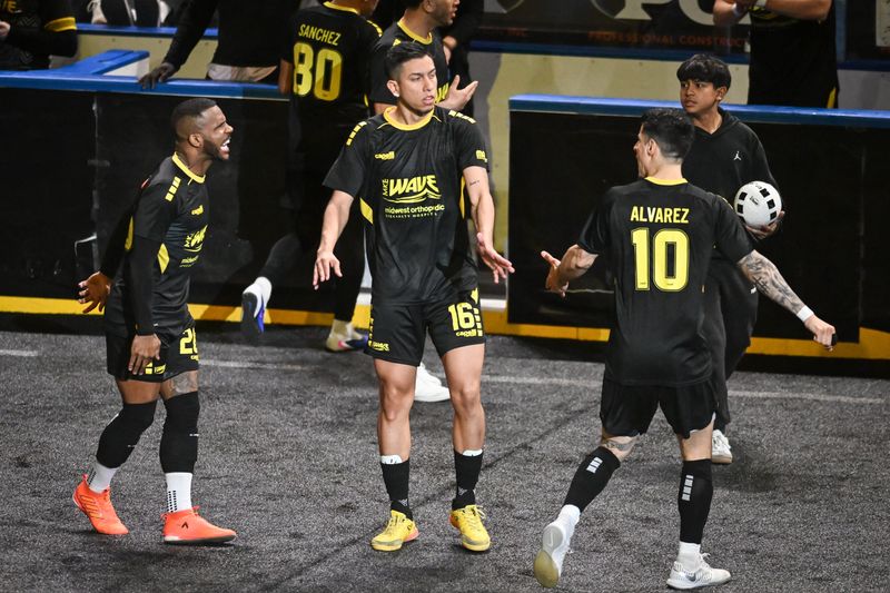 Milwaukee Wave defender Mario Alvarez (10) congratulates forward Oscar Flores (16) after a goal against the Baltimore Blast in a game Friday, April 10, 2026, at the UWM Panther Arena in Milwaukee, Wisconsin. Baltimore won, 7-5.