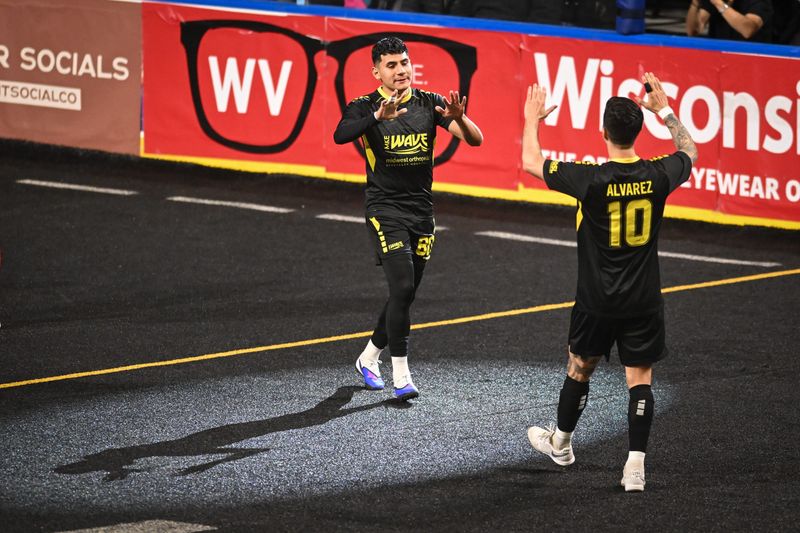 Milwaukee Wave midfielder Alex Sanchez (80), seen celebrating with defender Mario Alvarez in a previous game, scored what proved to be the winning goal April 24 at San Diego.