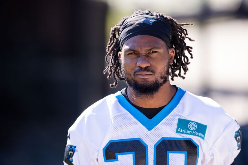 Jul 23, 2025; Charlotte, NC, USA; Carolina Panthers cornerback M.J. Devonshire (28) heads to the field for training camp.