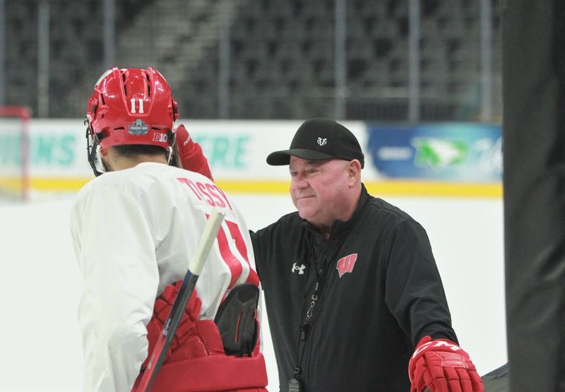 Wisconsin coach Mike Hastings chats with Simon Tassy during the team's final practice of the season on Friday April 10, 2026 at T-Mobile Arena in Las Vegas, Nevada..
