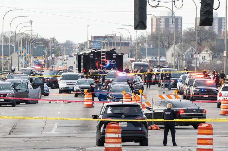 Police are seen on 35th Street near West National Avenue on April 13 in Milwaukee following a reported police shooting.