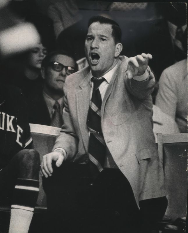 Larry Costello shots from the bench during his team's win over the Lakers in 1973.