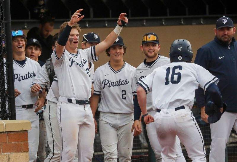 Bay Port High School's Cayden Heier (21) greets Josh Kleemann (16) after Kleemann scores a run against Green Bay Notre Dame on Tuesday, April 14, 2026, at Bay Port High School in Suamico, Wis. Bay Port won the game, 4-0.
Tork Mason/USA TODAY NETWORK-Wisconsin