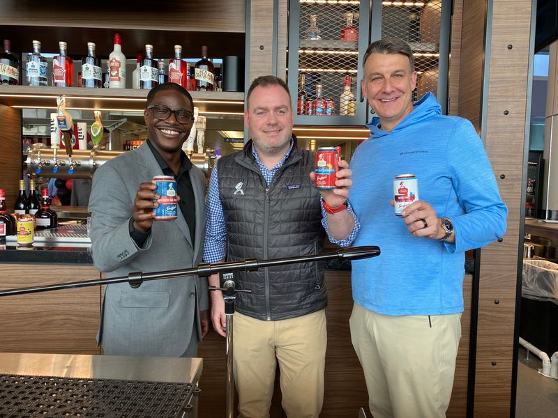 From left to right: Milwaukee County Executive David Crowley, Central Standard Craft Distillery co-founder Evan Hughes and Jim Kanter, Central Standard chief commercial officer, celebrate the opening of Central Standard Tavern at Mitchell Airport on April 15, 2026.
