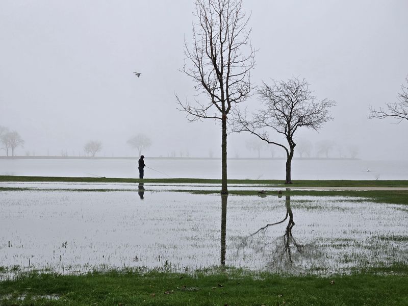 Fog and the recent rains don't prevent fishermen from enjoying Lake Winnebago on April 15, 2026.
