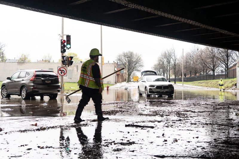 City of Milwaukee Department of Public Works responds to a flood beneath a bridge along West Fond du Lac Avenue and West Locust Street on April 16, 2026, in Milwaukee, Wisconsin. - Angelica Edwards / The Milwaukee Journal Sentinel