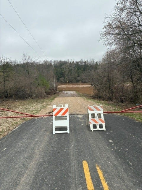 A road in Manitowoc County is barricaded due to high flood waters.