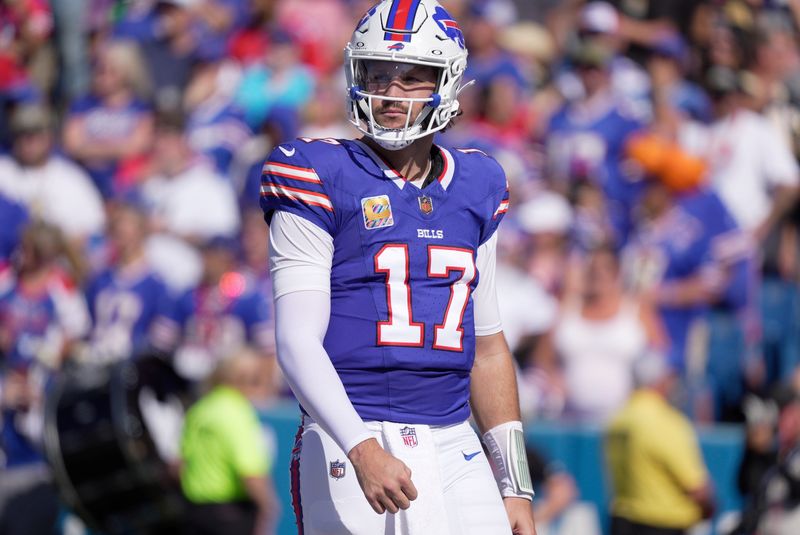 Buffalo Bills quarterback Josh Allen turns and looks towards the coaches at the end of the play during first half action of the Bills home game against the New Orleans Saints in Orchard Park.