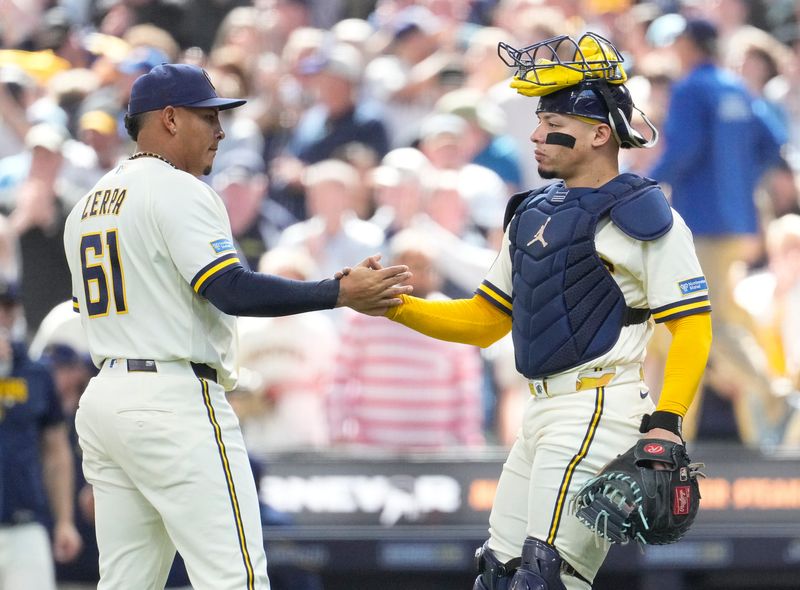 Brewers reliever pitcher Angel Zerpa (61) is greeted by catcher William Contreras after closing out the Blue Jays in the ninth inning on Thursday, April 16 at American Family Field.