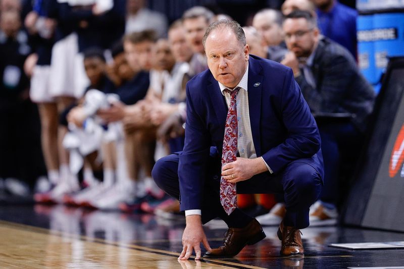 Mar 20, 2025; Denver, CO, USA; Wisconsin Badgers head coach Greg Gard looks on during the second half against the Wisconsin Badgers in the first round of the NCAA Tournament at Ball Arena. Mandatory Credit: Isaiah J. Downing-Imagn Images