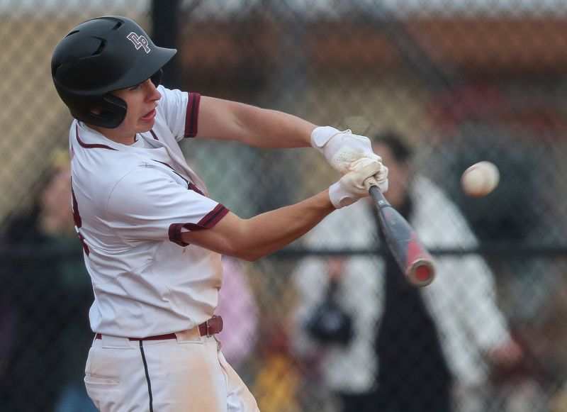 De Pere High School's Isaac Herlache (22) swings at a pitch against Green Bay Preble High School on Friday, April 17, 2026, at Aurora BayCare Field in De Pere, Wis. De Pere won the game, 5-3.
Tork Mason/USA TODAY NETWORK-Wisconsin