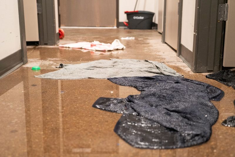 Towels soak up water that flooded Mishayia Dupriest-Hill’s apartment in Community Within the Corridor on April 16, 2026, in Milwaukee, Wisconsin.