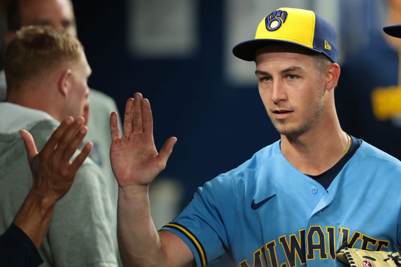 Brewers starting pitcher Coleman Crow (57) celebrates with teammates after exiting the game against the Miami Marlins during the sixth inning Friday night at loanDepot Park.