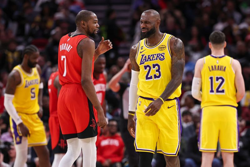 Mar 16, 2026; Houston, Texas, USA; Houston Rockets forward Kevin Durant (7) talks with Los Angeles Lakers forward LeBron James (23) on the court during the second quarter at Toyota Center. Mandatory Credit: Troy Taormina-Imagn Images
