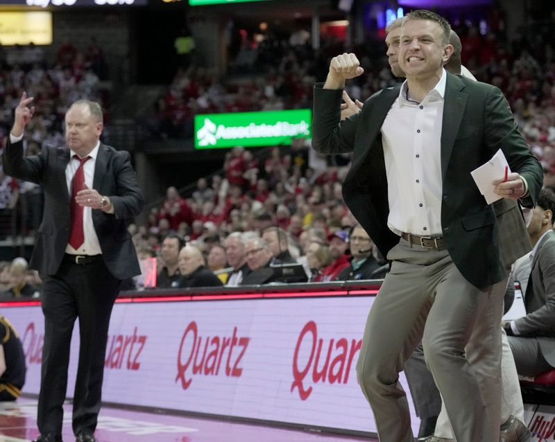 Wisconsin special assistant to the head coach Brad Davison reacts after an Iowa foul during the second half of the game Sunday, February 22, 2026 at the Kohl Center in Madison, Wisconsin. Wisconsin beat Iowa 84-71.