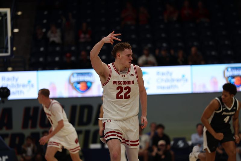 Nov 27, 2025; San Diego, CA, USA; Wisconsin Badgers forward Austin Rapp (22) reacts after scoring against the Providence Friars during the first half at Jenny Craig Pavilion. Mandatory Credit: Abe Arredondo-Imagn Images