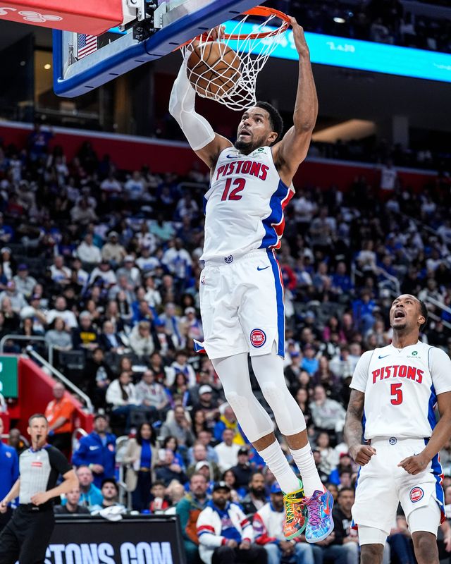 Detroit Pistons forward Tobias Harris (12) dunks against Orlando Magic during the first half of Game 1 of the first round of the NBA playoffs at Little Caesars Arena in Detroit on Sunday, April 19, 2026.