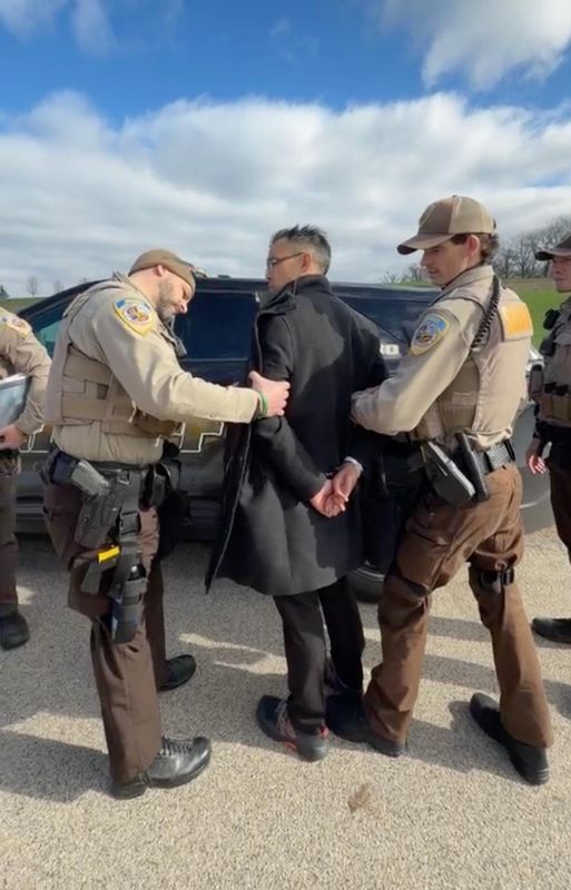 Animal rights attorney Wayne Hsiung is arrested at Ridglan Farms on April 18, 2026. The Dane County Sheriff's Office said Hsiung, the lead organizer of the break-in attempt, was arrested "within minutes of arriving" on probable cause for conspiracy to commit burglary.