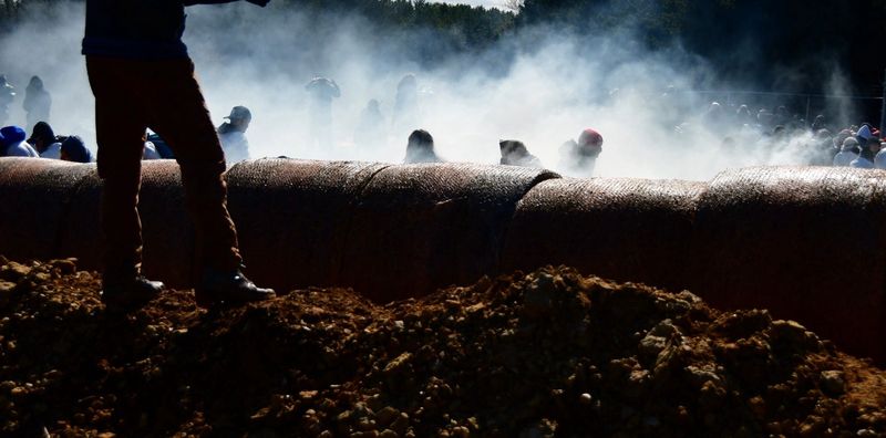 Tear gas rises at Ridglan Farms on April 18, 2026, as law enforcement responds to hundreds of activists attempting to enter the Blue Mounds beagle breeding facility.