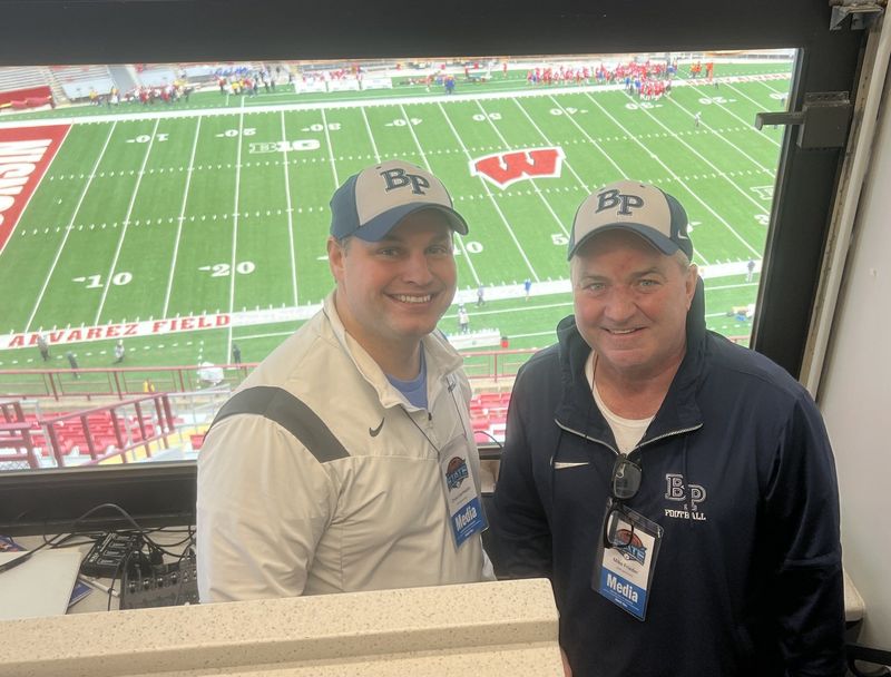 Christoper Liermann, left, and former Bay Port principal Mike Frieder, right, have called Bay Port football games together the past 11 years.