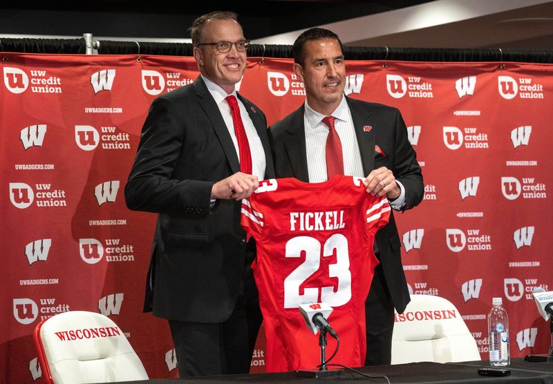 Wisconsinâ€™s new head football coach Luke Fickell, right, is shown with athletic director Chris McIntosh at a news conference Monday, November 28, 2022 at Camp Randall Stadium in Madison, Wis. He was previously head coach for six seasons at Cincinnati.