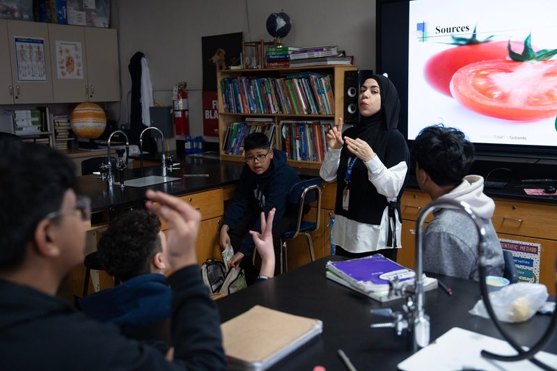 Noor Jubeh engages her middle school students about nutrition, asking them about their breakfast choices, at Salam School on the morning of Feb. 16, 2026, in Milwaukee, Wisconsin.