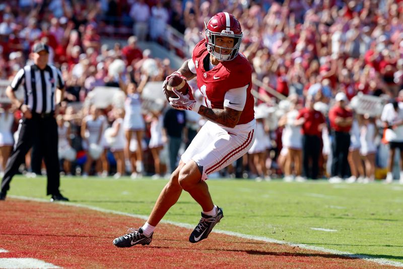 Oct 12, 2024; Tuscaloosa, Alabama, USA; Alabama Crimson Tide defensive back Domani Jackson (1) intercepts a pass to seal the win over the South Carolina Gamecocks during the second half at Bryant-Denny Stadium. Mandatory Credit: Butch Dill-Imagn Images