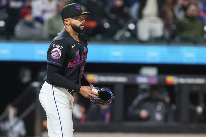 New York Mets relief pitcher Devin Williams reacts after walking in a run in the ninth inning against the Minnesota Twins at Citi Field on April 21, 2026, in New York.