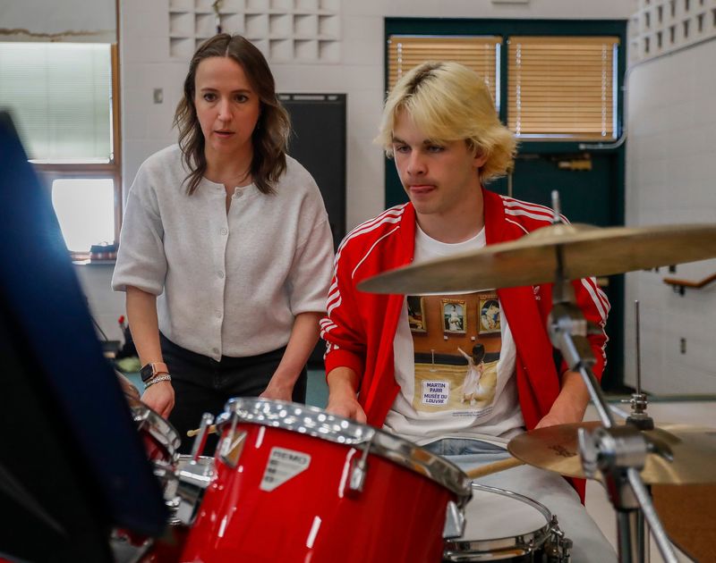 Ashwaubenon High School band director Ellen Moon, left, helps student Julen Madariaga work through a section of music on April 22 at Ashwaubenon High School.