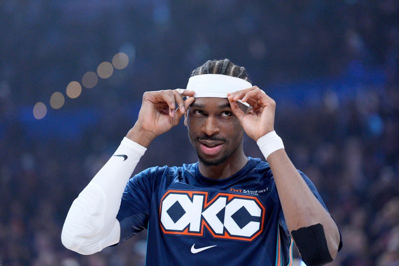 Oklahoma City Thunder guard Shai Gilgeous-Alexander (2) adjusts his headband before Game 2 of the first round NBA playoff series between the Oklahoma City Thunder and the Phoenix Suns in Oklahoma City, Wednesday, April 22, 2026. Oklahoma City won 120-107.