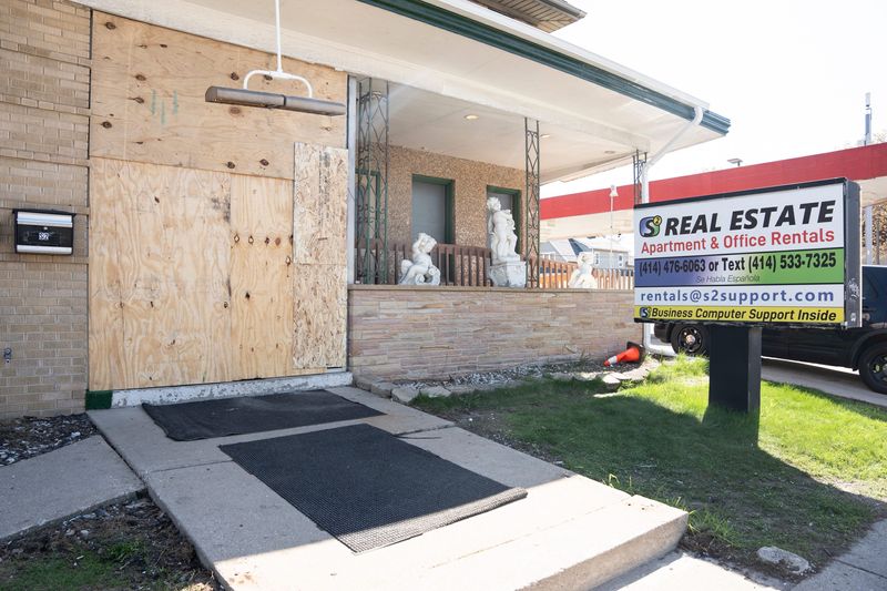 S2 Real Estate’s office on West Lincoln Avenue boarded up after federal agents raided the building on April 22, 2026, in Milwaukee, Wisconsin.