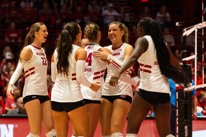 Wisconsin volleyball players celebrate a point during the Badgers' spring win over Northern Illinois at the UW Field House in Madison on April 24, 2026.