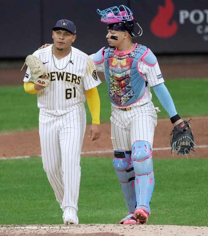 Brewers pitcher Angel Zerpa (61) and catcher William Contreras talk during a game April 25. Zerpa was placed on the 15-day IL on April 29 with left forearm tightness, retroactive to April 26.