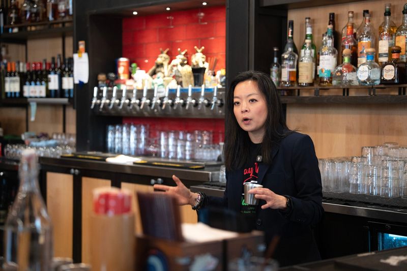 Democratic governor candidate Francesca Hong answers questions from community members from behind the bar at DanDan during a campaign event on the afternoon of April 26, 2026 in Milwaukee, Wisconsin.