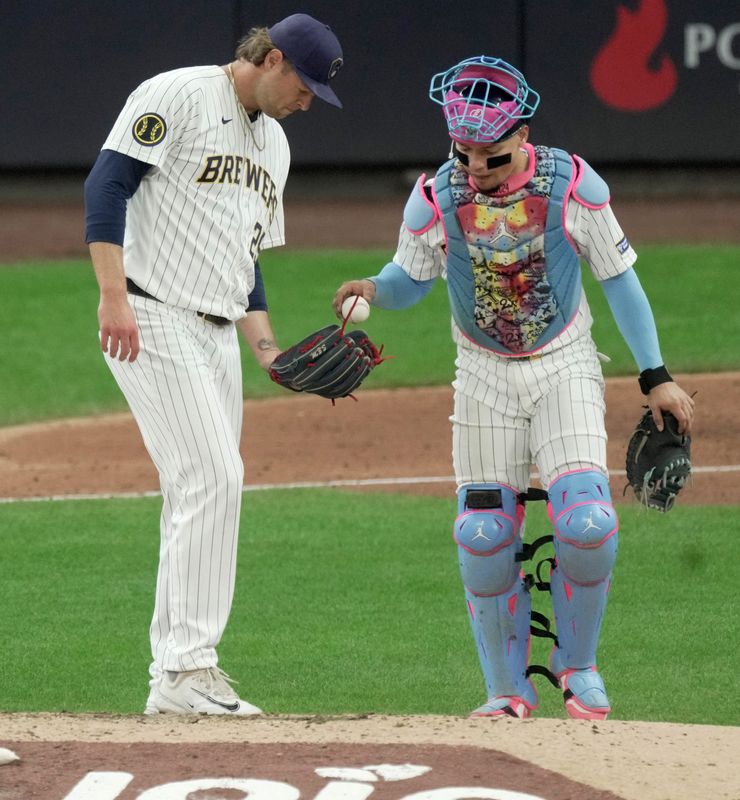 Milwaukee Brewers pitcher Trevor Megill (29) is met at the mound by catcher William Contreras (24) during the seventh inning of their game against the Pittsburgh Pirates Sunday, April 26, 2026 at American Family Field in Milwaukee, Wisconsin.