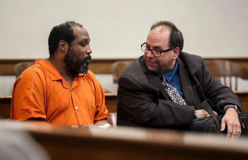 Junius Jackson, left, confers with defense attorney Jason Farris before a sentencing hearing on April 27, at the Brown County Courthouse in Green Bay. Jackson was sentenced to 10 years in prison and five years of extended supervision after being convicted of first-degree reckless injury with the use of a dangerous weapon, misdemeanor bail jumping and felony victim intimidation as a party to a crime in relation to a New Year's Eve 2024 stabbing in Green Bay.