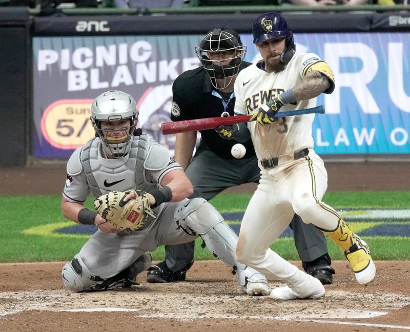 Milwaukee Brewers shortstop Joey Ortiz (3) hits a sacrifice bunt single and advance to first on a throwing error during the sixth inning of their game against the Arizona Diamondbacks Thursday, April 28, 2026 at American Family Field in Milwaukee, Wisconsin.



Mark Hoffman/Milwaukee Journal Sentinel