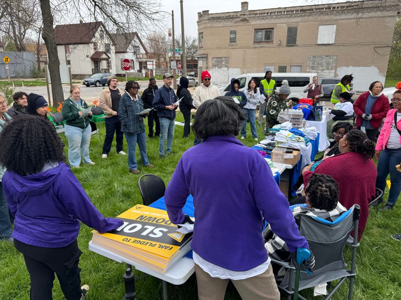 Volunteers gather around Metcalfe Park Community Bridges deputy director Melody McCurtis at the 2026 Metcalfe Park Big Clean and Walking Audit on April 25, 2026.