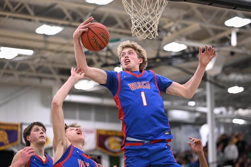 Wisconsin Lutheran guard Kager Knueppel (1) beats brother Kash Knueppel to a rebound against Greendale in a game Tuesday, January 20, 2026, at Greendale High School in Greendale, Wisconsin.